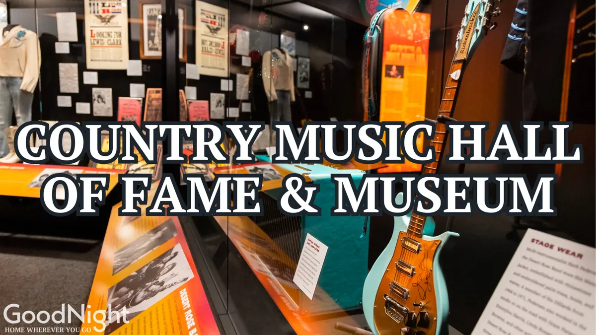 A museum interior with displays highlighting guitars, iconic stage wear, and information panels about country music history. The memorabilia and exhibits invite guests to experience the legacy of Nashville’s musical icons up close.